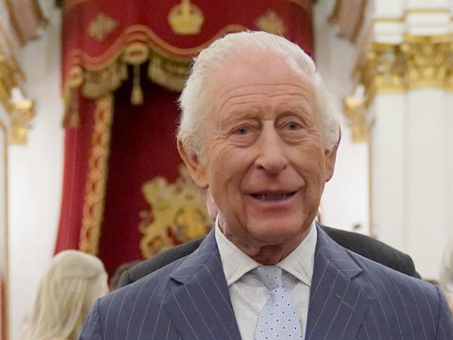 LONDON, ENGLAND - APRIL 30: King Charles III speaks to guests during a reception in celebration of community-based initiatives raising awareness about cancer and supporting those living with cancer at Buckingham Palace on April 30, 2025 in London, England. (Photo by Yui Mok - WPA Pool/Getty Images)