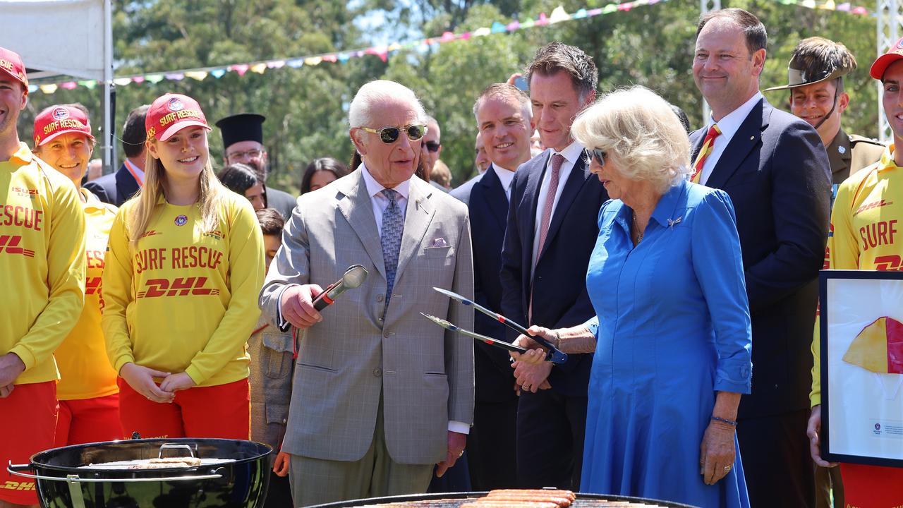 King Charles III and Queen Camilla cook sausages at Parramatta Park. Picture: Chris Jackson/Getty Images)