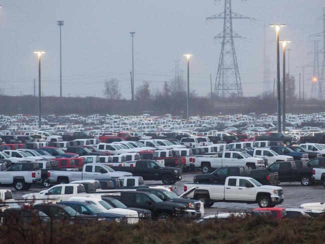 Hundreds of General Motor vehicles parked outside the GM Assembly plant in Oshawa, Ontario which has since closed, the first of five GM factories to do so. Picture: AFP