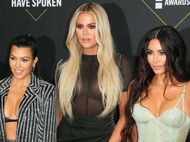 (FILES) In this file photo taken on November 10, 2019 (L-R) Business women/media personality Kris Jenner, Kourtney Kardashian, KhloÃ© Kardashian and Kim Kardashian arrive for the 45th annual E! People's Choice Awards at Barker Hangar in Santa Monica, California. - Fans will have to find another way to keep up with the Kardashians, as the mega-celebrity family announced on September 8, 2020 that their reality show will end next year. "It is with heavy hearts that we've made the difficult decision as a family to say goodbye to Keeping Up with the Kardashians," Kim Kardashian wrote in a post to her 188 million Instagram followers. (Photo by Jean-Baptiste Lacroix / AFP)