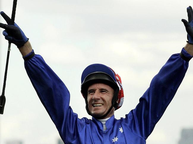 Gympie jockey Glen Boss salutes the crowd in the mounting Yard after winning the Melbourne Cup on Makybe Diva at Flemington Racecourse, Melbourne, Australia, Tuesday, Nov. 1, 2005. Makybe Diva, a seven-year-old English-born mare, become the first horse to win Australia's richest and most famous race three times in a row, scoring a stirring victory in Tuesday's Melbourne Cup at Flemington. (AP Photo/ Tony Feder)