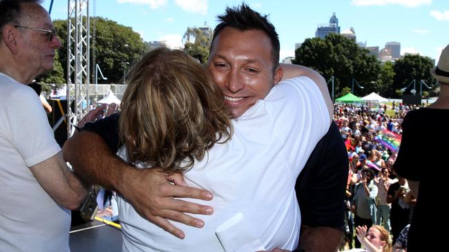Swimmer Ian Thorpe hugs Magda Szubanski after ‘Yes’ won the same-sex marriage postal vote. (Jane Dempster/The Australian)