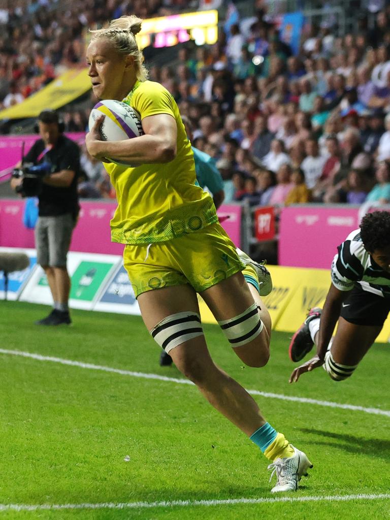 Maddison Levi runs away for another try. Photo by David Rogers/Getty Images