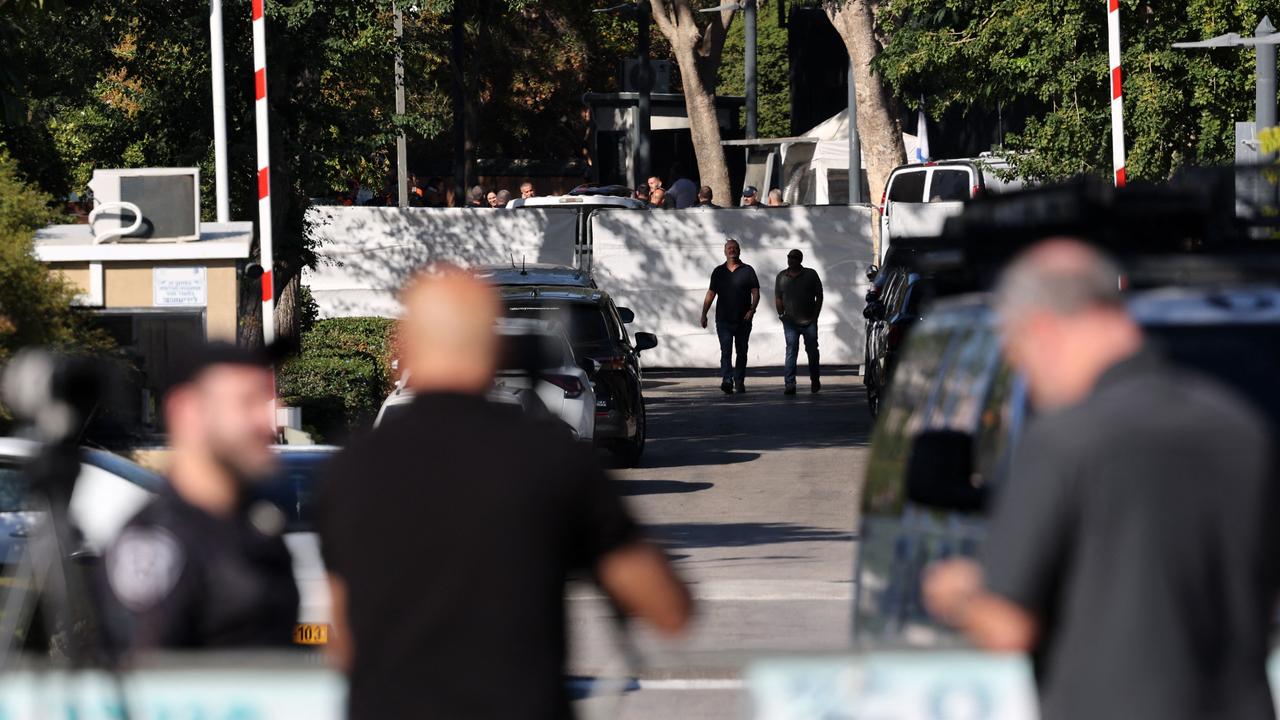 Israeli security forces gather behind a barrier across a street leading to Prime Minister Benjamin Netanyahu's residence in Caesarea on October 19, 2024. Picture: AFP.