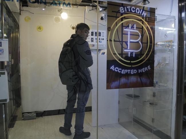 A man uses a Bitcoin ATM in Hong Kong this month. Picture: Kin Cheung