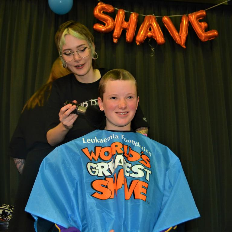 At the St Joseph's College 2023 World's Greatest Shave event is Meghan Ellis getting her cut by hairdresser Caitlin Symes from the Hair Room on Russell. Picture: Rhylea Millar