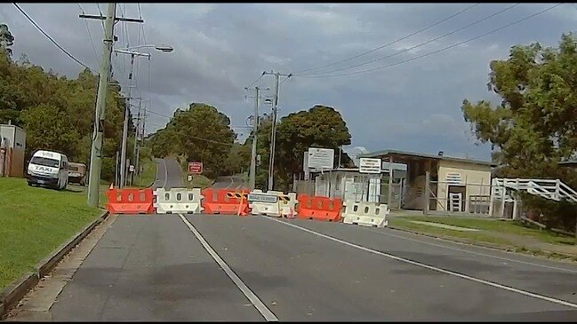 Taxi crosses the NSW border COVID-19 barrier at Kirra on the Gold Coast