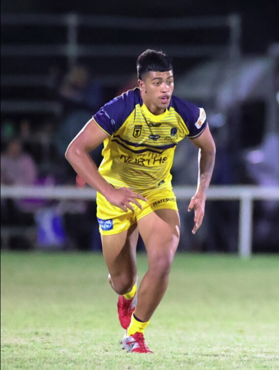 Xaiver Willison in action for Norths Devils. He is being nursed along by Devils head coach Rohan Smith. credit Alan Drinnen/Norths Devils.