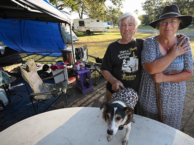 21/7/2024: Tracey Hind 58 and partner Stephen Ibbetson 72 (with 19yr old Charlie the dog) Tracey Wilkinson 59 are among the 40 or so homeless people being warned they might be asked to leave their camp ground in a car park at the show grounds in Lawnton, Brisbane. pic: Lyndon Mechielsen/Courier Mail