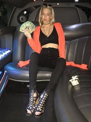 Melissa Garbin poses in the back of a limousine