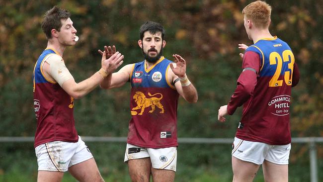 Alex Colaidis celebrates a goal with South Morang teammates. Picture: Hamish Blair