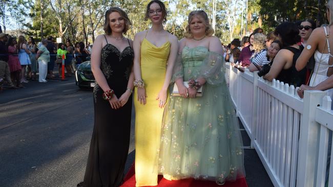 Ruby Mateer, Bella Stevens and Grace Hartley at the North Rockhampton High School Formal 2023.