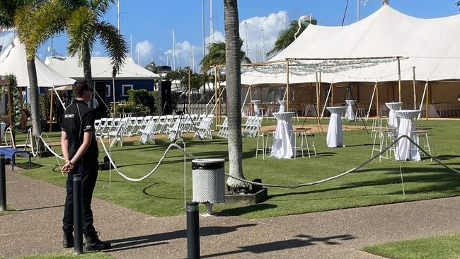 Security guards were posted throughout the Bundaberg Port Marina, guarding a roped-off area on the lawn for the wedding ceremony and reception.
