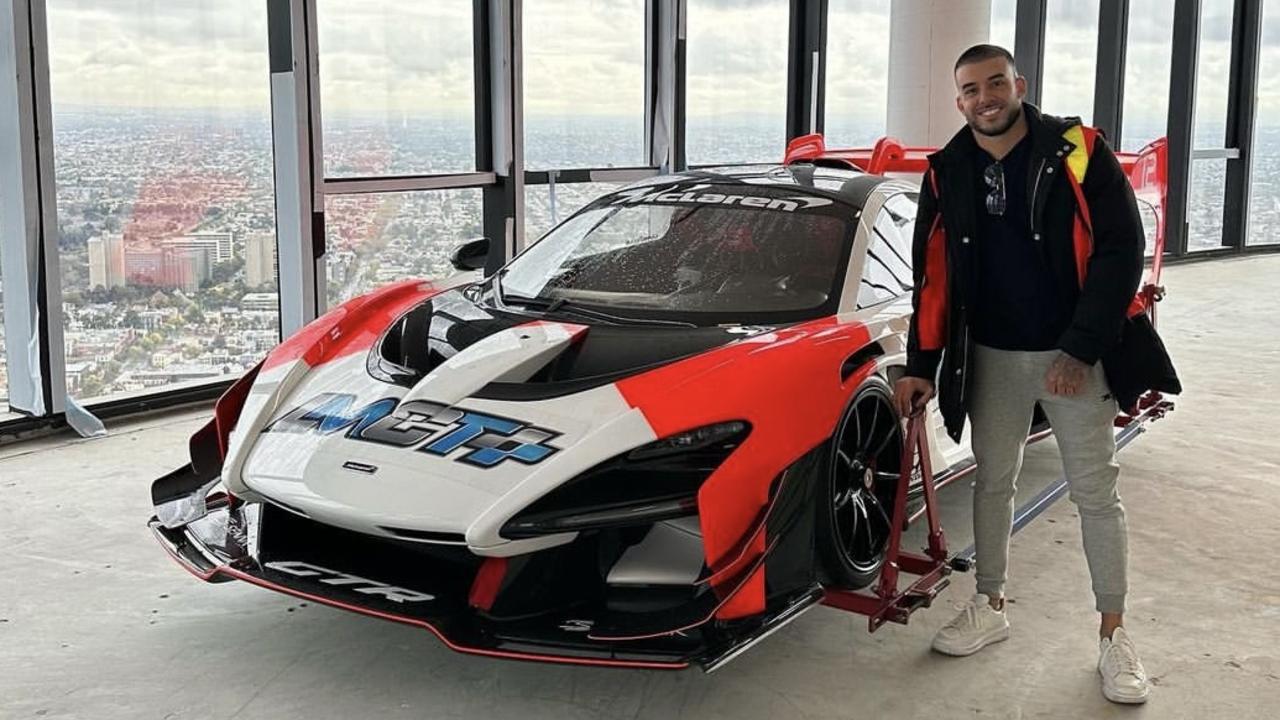 Mr Portelli with his $3m McLaren after it was craned into his Melbourne penthouse. Image supplied.