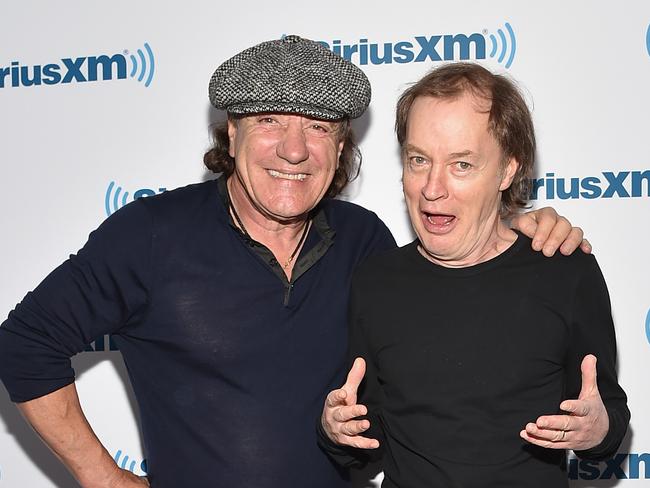 Concern ... Guitarist Angus Young, right, with singer Brian Johnson. Picture: Mike Coppola/Getty Images