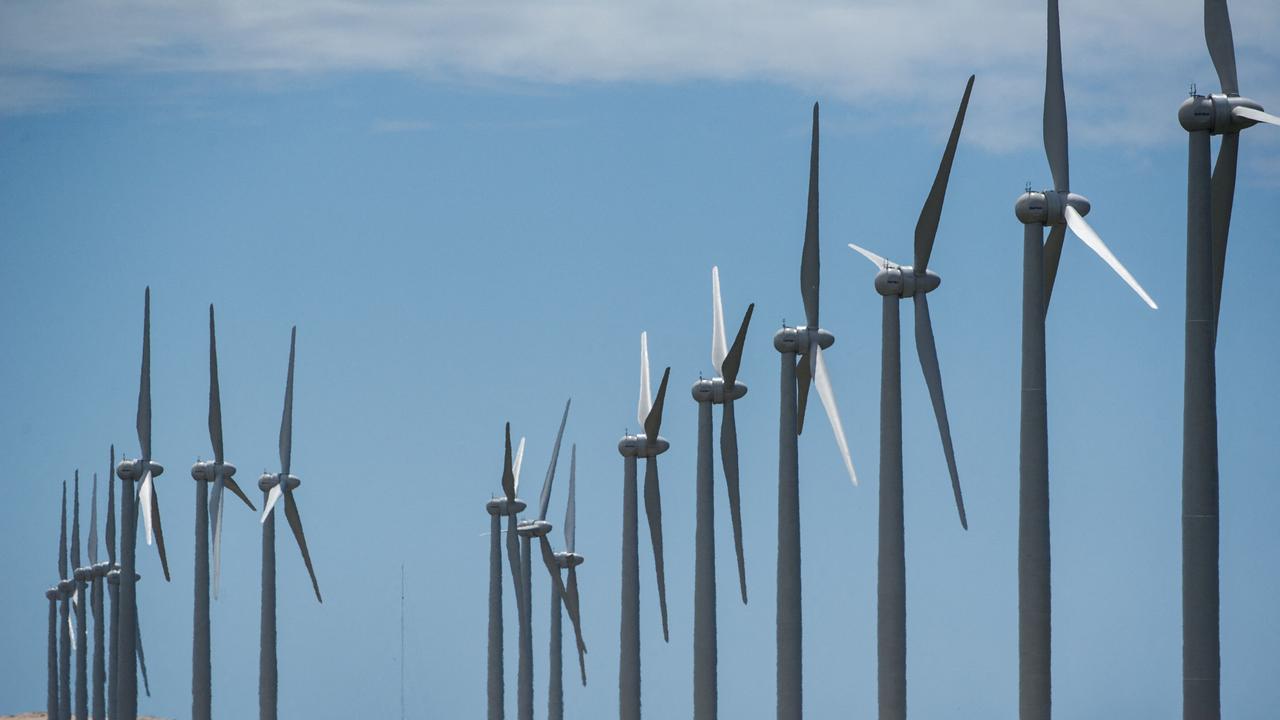 Former Reserve Bank deputy governor Guy Debelle said Australia must accelerate the development of renewable energy generation projects or risk soaring electricity prices for households and businesses. Picture: Yasuyoshi Chiba/AFP