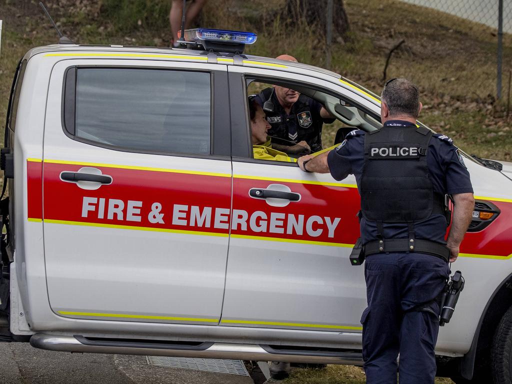 Smoke haze covers the Gold Coast Skyline from a grass fire at Carrara. Emergency services at St Michael's Collage, Merrimac. Picture: Jerad Williams