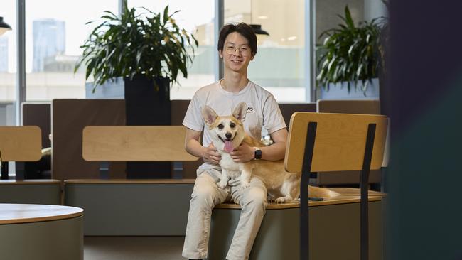 Simon Duan and Mochi the corgi at Amazon’s Melbourne office.