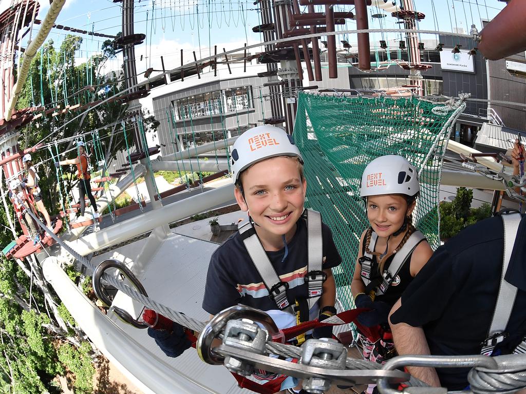 Will, 11, and Holly Teissl, 8. Opening of the much-anticipated Next Level Australias largest high ropes course located on Cornmeal Creek at Sunshine Plaza. Picture: Patrick Woods.