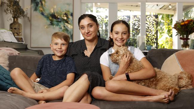 Gwen Cherne with her kids Emily, 9, and Lachlan, 6, and dog Scout last year in their home. Picture: Tim Hunter