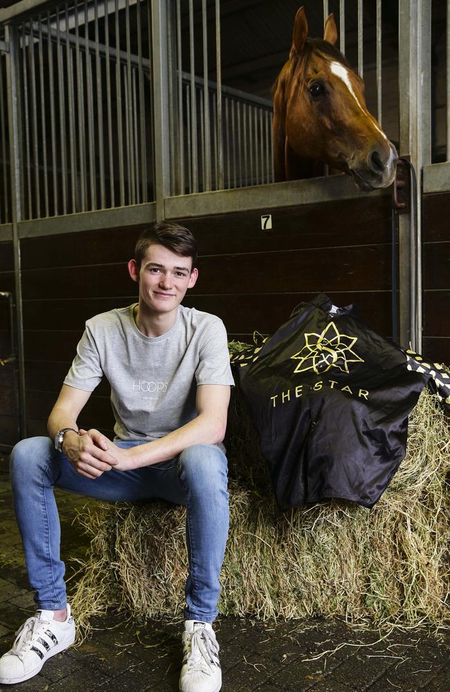 Jockey Regan Bayliss and his new silks, which he will wear when he rides Redkirk Warrior at Randwick on Saturday. Picture: Justin Lloyd