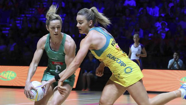 Australia’s Liz Watson (right) challenges Northern Ireland's Caroline O'Hanlon on Friday night. Picture: AP