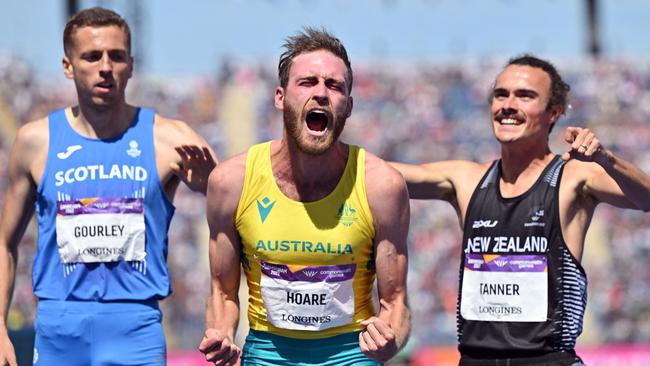 Australia's Oliver Hoare (C) reacts after winning the 1500m final at the Commonwealth Games.