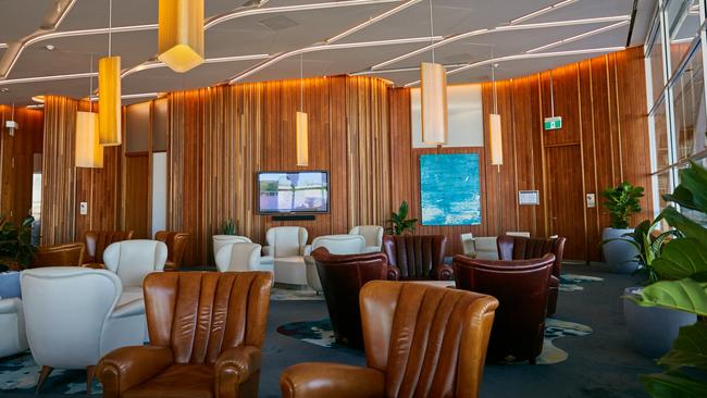 Virgin Australia’s invitation only Beyond lounge has opted for lots of leather and wood panelling. Source: Supplied.,