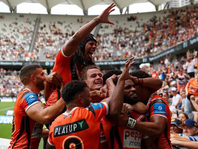 Wests Tigers' Jarome Luai and Sunia Turuva bring out the claw cleberation. Picture: NRL