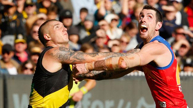 Dustin Martin of the Tigers and Darcy Gardiner of the Lions compete.