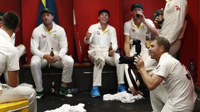 David Warner takes pictures of temmates following the fourth Test win in Manchester. Picture: Getty Images