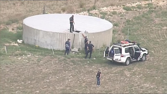 Police search the Meningie property where the backpacker was allegedly held. Picture: 7 News