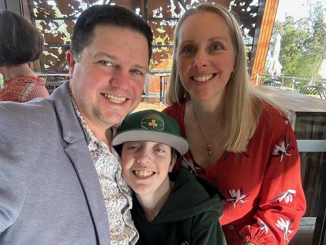 Tyler Caulfield, 15, with his father Leigh and mother Laura. Tyler suffers from mitochondrial deletion syndrome. Picture: Supplied