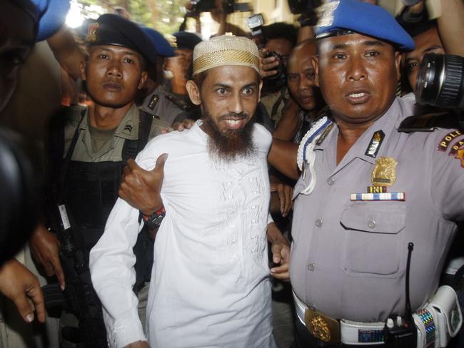 Umar Patek arrives at Bali Police Headquarters in Denpasar, Bali, Indonesia, in 2011.