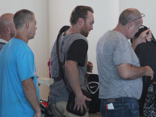 Jetstar trouble makers depart Denpasar Airport in Bali. Mark Rossiter is escorted onto the plane. Picture: Supplied