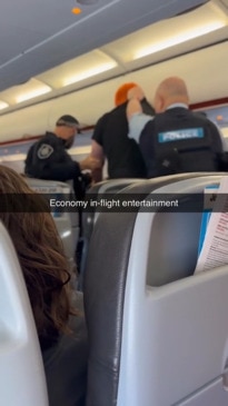 Dramatic moment man dragged off Jetstar flight