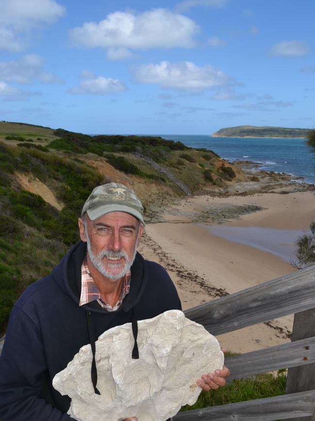 Big bones: Mike Cleeland <s1>at the San Remo cliffs with a concrete mould of the fossil named in his honour. </s1>Picture: Sarah Hudson