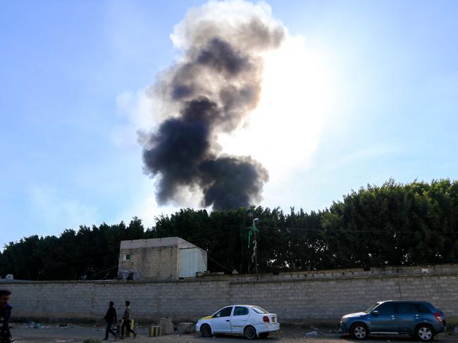 Smoke billows from the site of an Israeli airstrike that targeted a power station in the Huthi-run Yemeni capital Sanaa on December 19, 2024. Yemen's Huthi rebels on December 19 claimed a missile attack against Israel that was intercepted and prompted Israeli strikes on key infrastructure in Yemen including ports and energy facilities. (Photo by Mohammed HUWAIS / AFP)