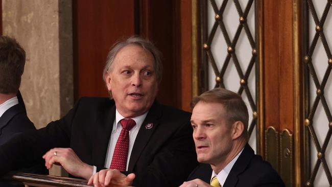 Andy Biggs talks to Jim Jordan in the House Chamber during the third day of elections for Speaker of the House. Picture: Getty Images via AFP.