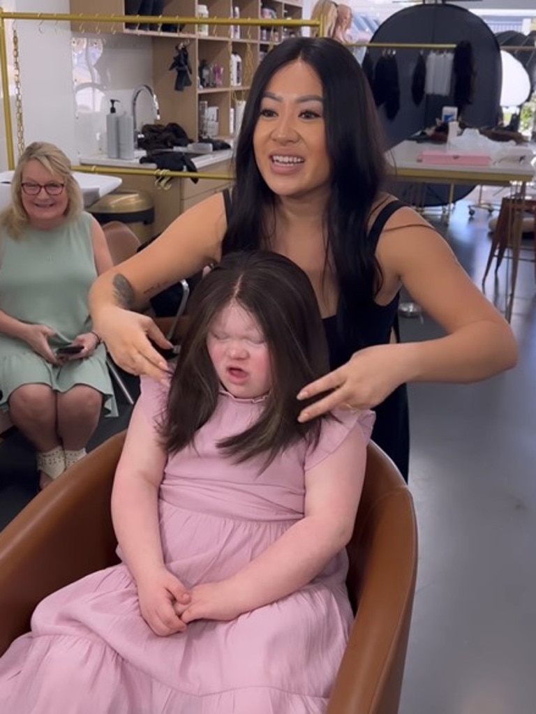 Moment 10yo girl with alopecia and Down syndrome gets first wig