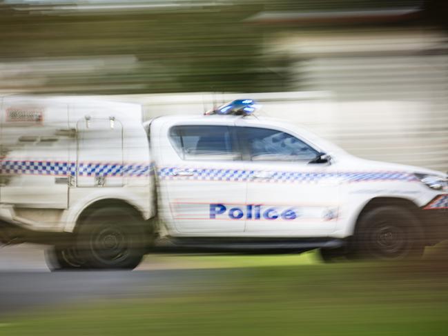 A police vehicle under lights and sirens on Ruthven St in Toowoomba, Wednesday, April 24, 2024. generic Queensland Police, QPS, police Picture: Kevin Farmer