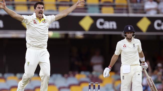 Pat Cummins had a big day for Australia, taking two key wickets, including that of Joe Root. Picture: AP