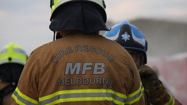 Fire crews scrambled to a house fire in Greensborough last night where a woman in her 90s was rescued.