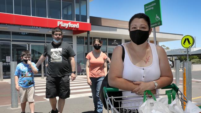 Tammy Camp and her family, Lachlan, 9, Adyson, 14, and husband Robert Camp, at Playford shopping centre. The Playford council area has SA’s highest number of cases. Picture: Dean Martin