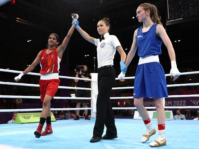 BIRMINGHAM, ENGLAND - AUGUST 03: Nitu Nitu (red) of Team India celebrates defeating Nicole Clyde (blue) of Team England in the Women’s Boxing Over 45kg-48kg Minimumweight Quarter-Final on day six of the Birmingham 2022 Commonwealth Games at NEC Arena on August 03, 2022 in Birmingham, England. (Photo by Eddie Keogh/Getty Images)