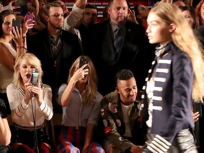 Taylor Swift, Martha Hunt, and Lewis Hamilton attend the #TOMMYNOW Women’s Fashion Show during New York Fashion Week on September 9, 2016. Picture: Getty