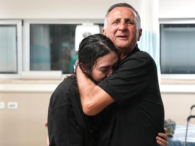 Noa Argamani, 26, being hugged by her father, Yaakov, at the Sheba Tel-HaShomer Medical Centre, after her rescue from the Gaza Strip by the Israeli army. Picture: AFP