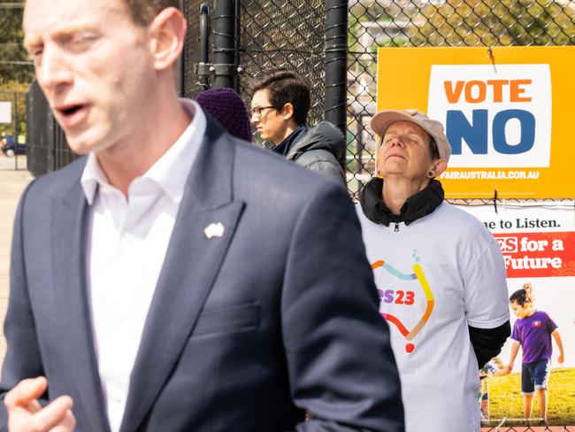 A woman volunteering for the YES23 campaign reacts to comments that SA Opposition Leader David Speirs makes speaking to media following his vote on the referendum. Picture: Morgan Sette/NCA Newswire