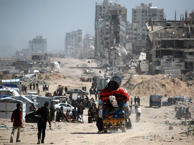People commute along the al-Rashid road, the only route linking the northern and southern parts of the Palestinian territory. Picture: AFP