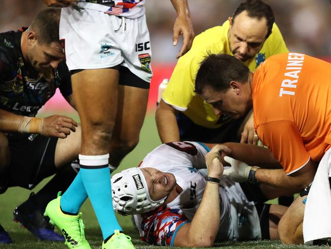 Jarrod Croker writhes in pain after falling awkwardly in a tackle. Picture: Brett Costello